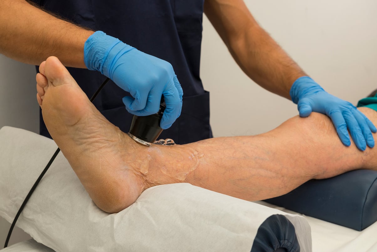 Senior man having ultrasound foot therapy